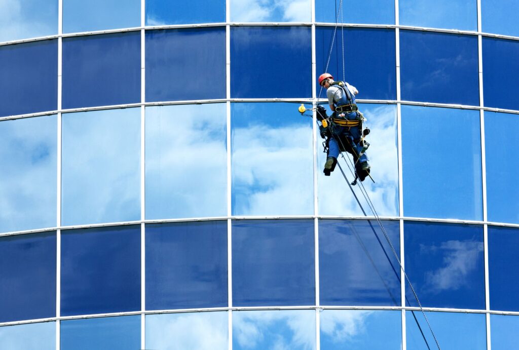 window cleaner on high-rise building