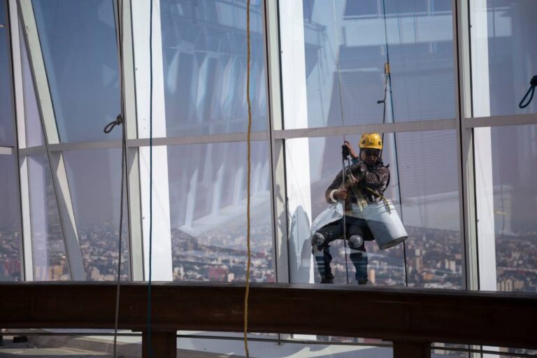 window cleaner repelling on high rise NYC building